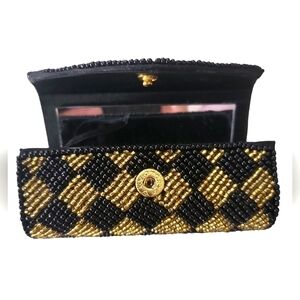 Elegant Black and Gold Beaded Cosmetic Case